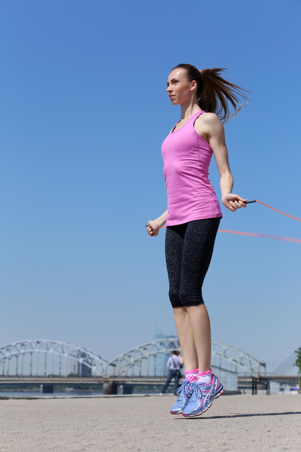 Free Image of Sport. Attractive girl with skipping rope 