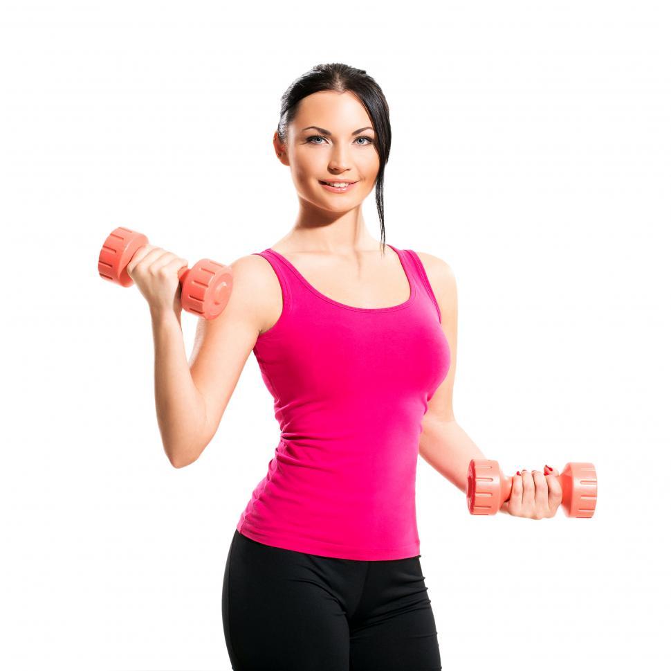 Free Image of Cute brunette during fitness exercise with weights 