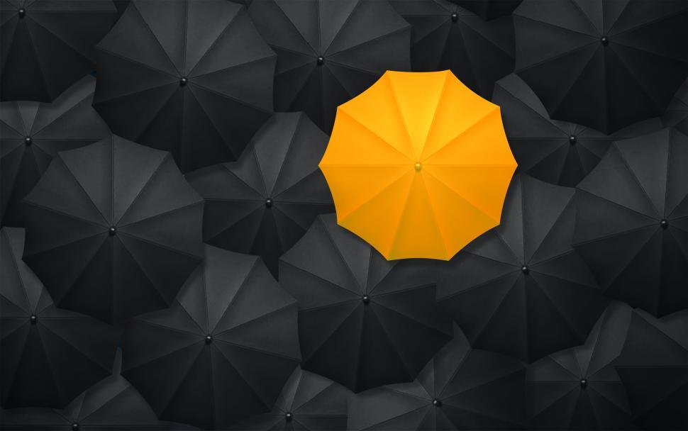 Free Image of Yellow Umbrella Contrasting With Black Umbrellas - Being Differe 