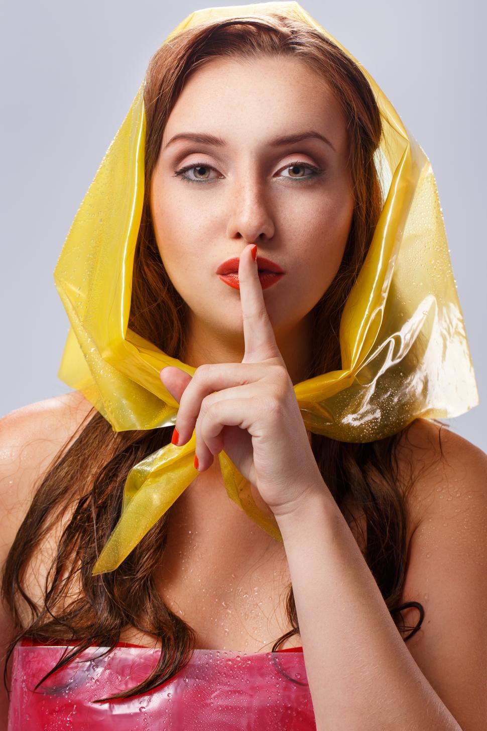 Free Image of Beautiful girl shushing during rainy day  