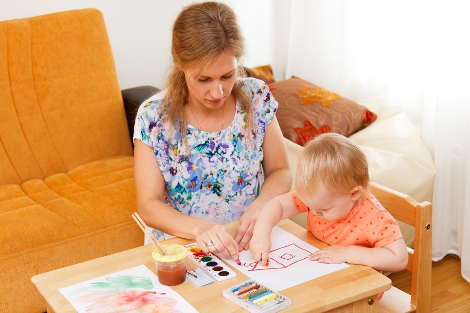 Free Image of Mother and her child painting 