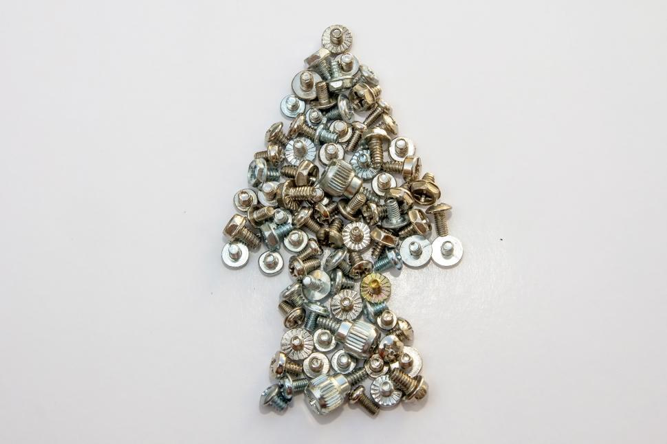 Free Image of A collection of bolts forms a direction arrow 