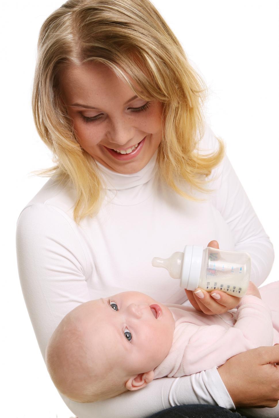 Free Image of a young and mother with kid in arms 