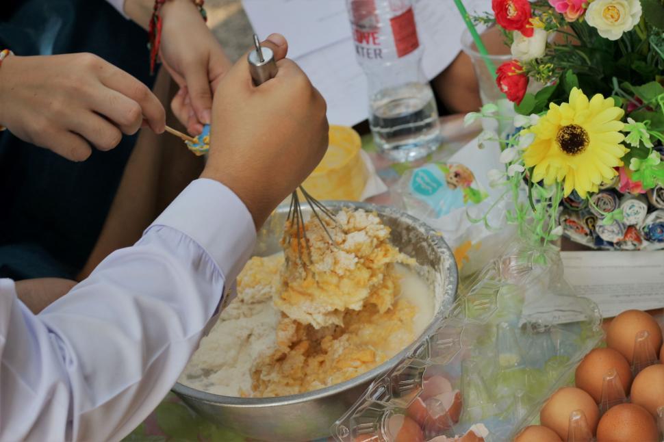 Free Image of Person mixing ingredients in a bowl  