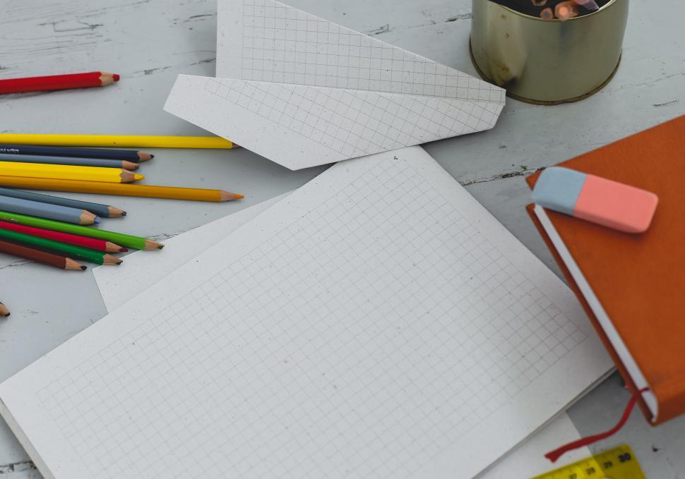Free Image of Diary on the table with art supplies 