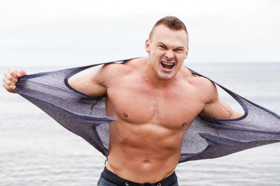 Free Image of Ripped bodybuilder on the beach 