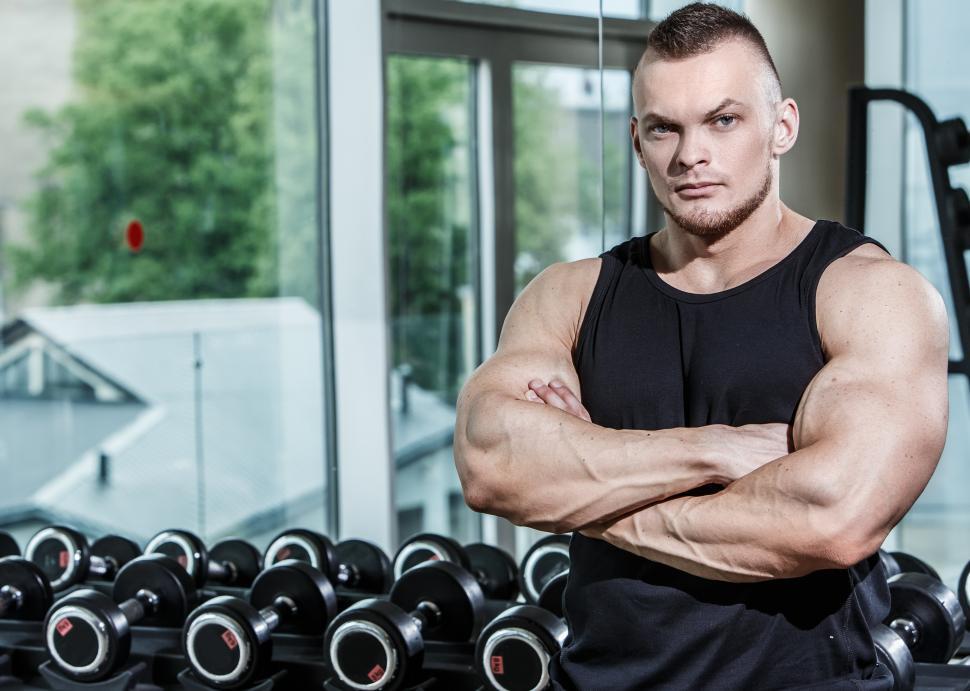 Free Image of Fitness. Man with arms crossed in the gym. Trainer. 