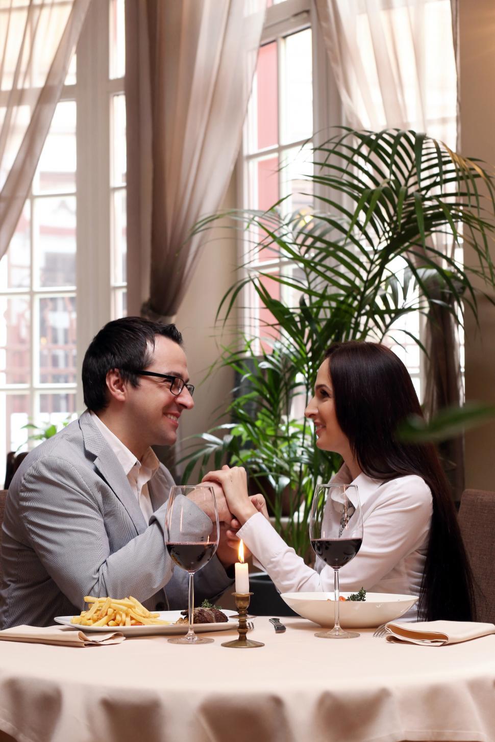 Free Image of Beautiful couple in elegant restaurant 