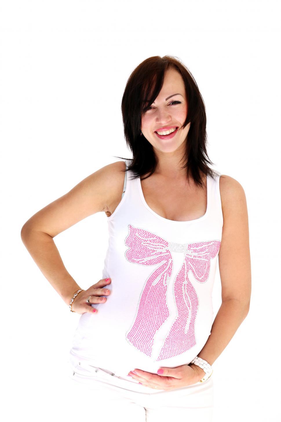 Free Image of Beautiful pregnant woman posing on white background 