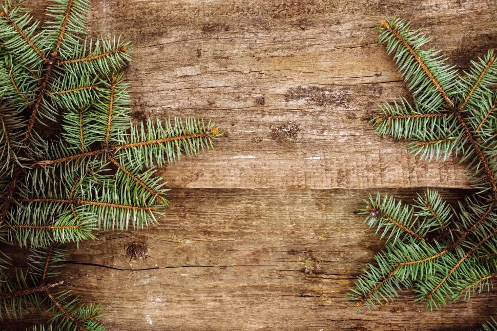 Free Image of Christmas. Fir limbs on the table background 
