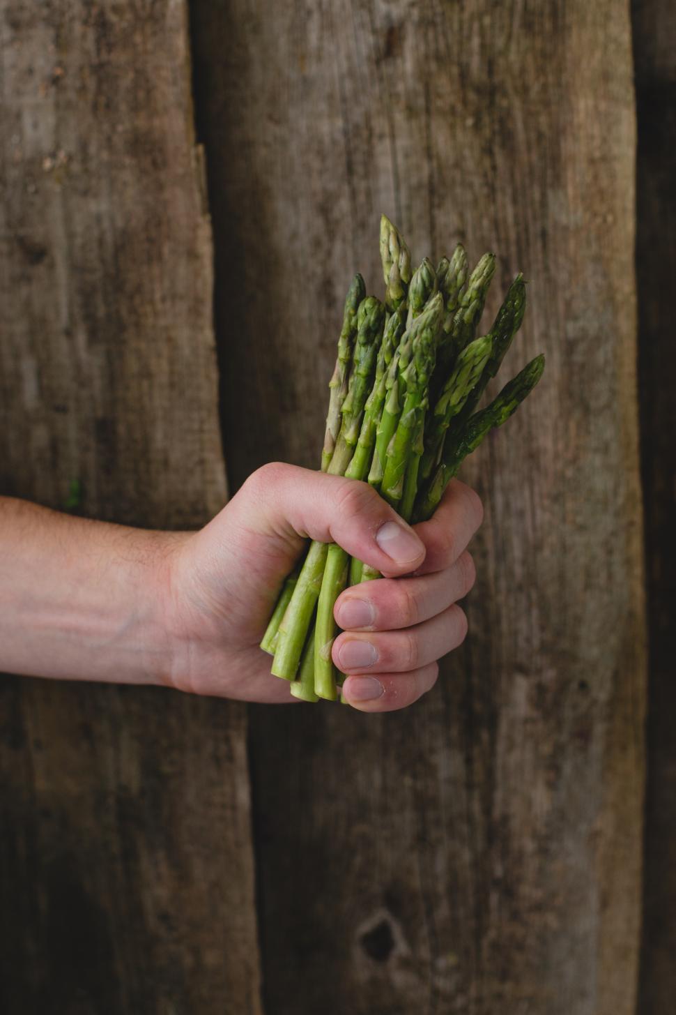 Free Image of Man holding asparagus 