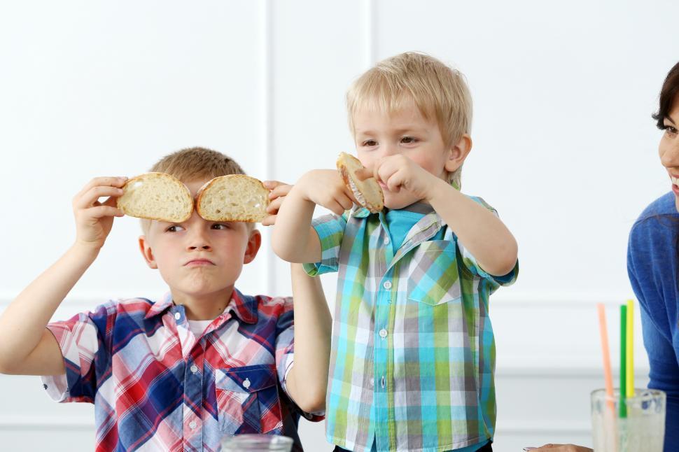 Free Image of Family having silly fun during breakfast 