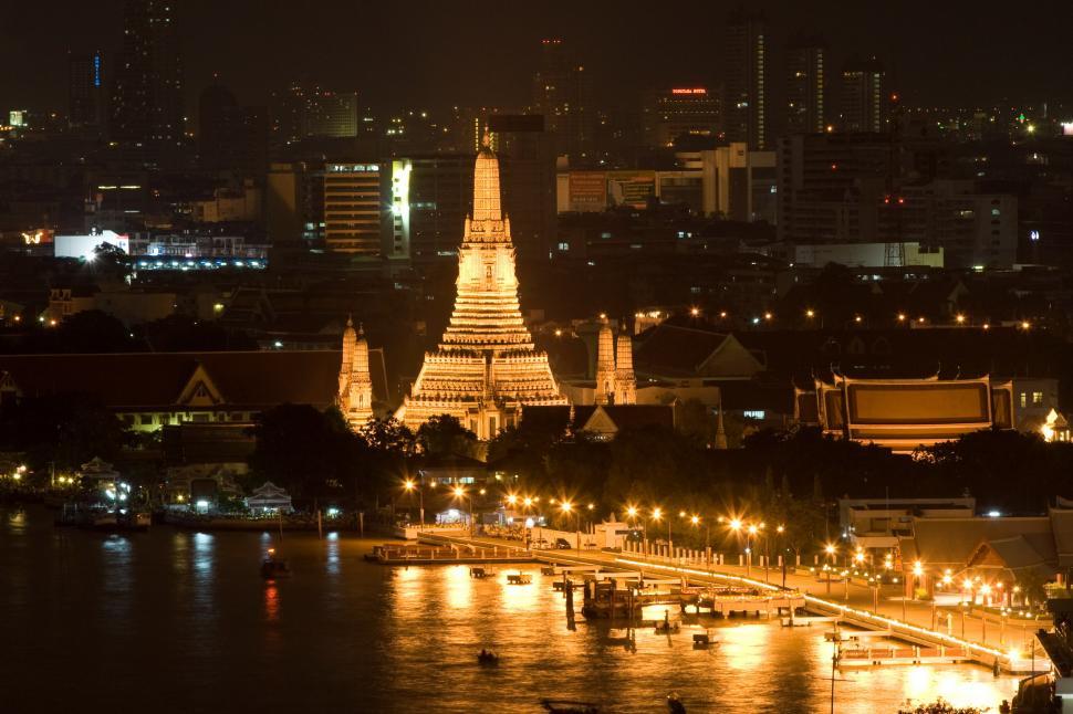 Free Image of Night View of City With Lit Up Christmas Tree 