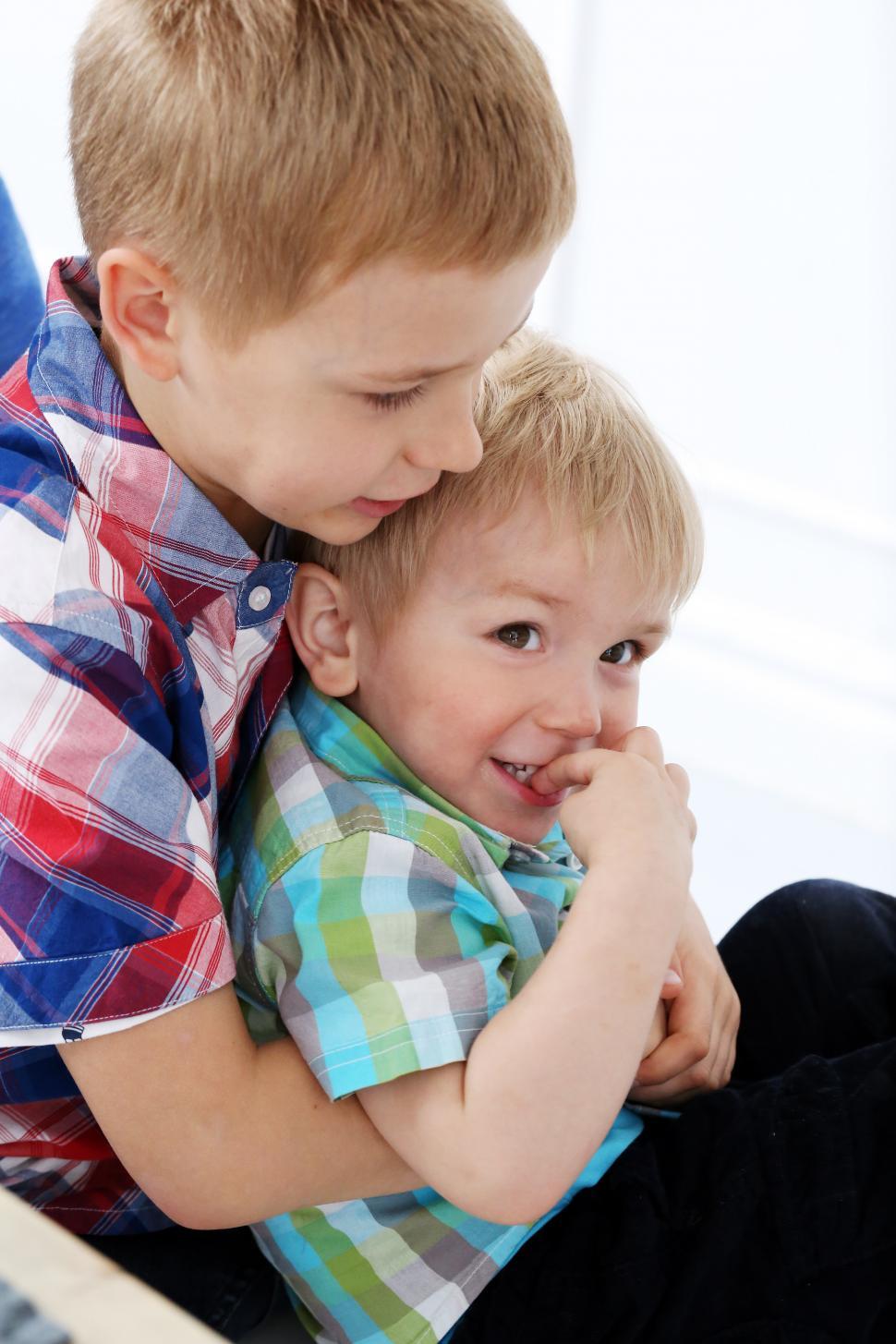 Free Image of Brothers together at the table 