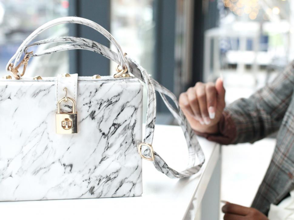 Free Image of White marble print handbag 