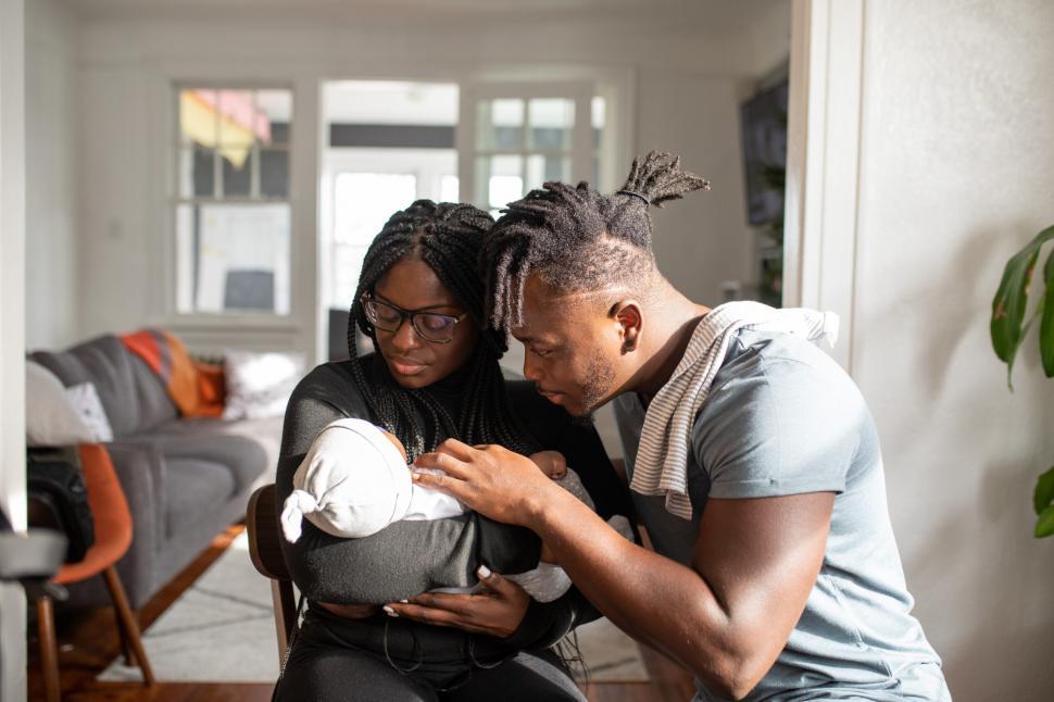 Free Image of Young Parents Caring Their Little Baby 