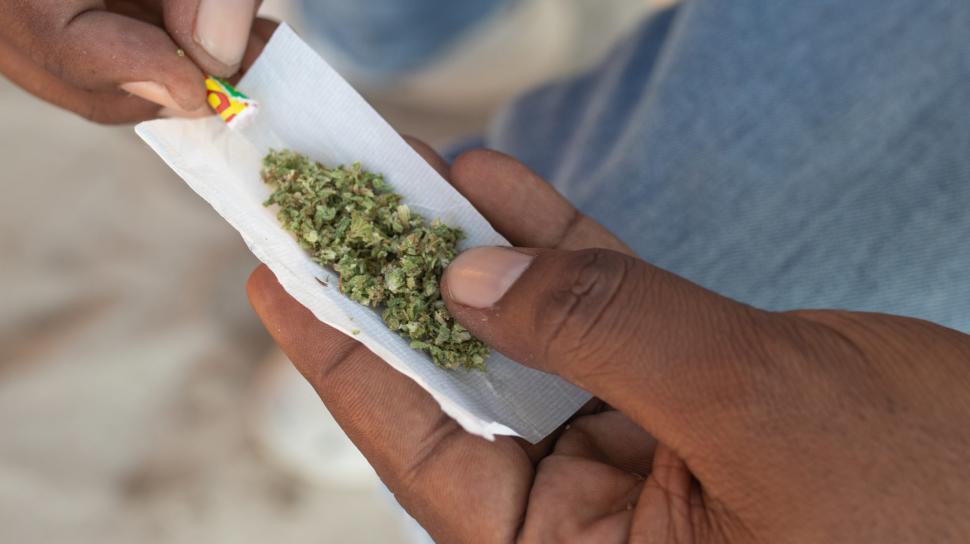 Free Image of Rolling a joint 