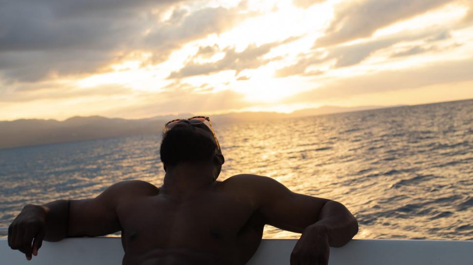 Free Image of Young Man Relaxing on Yacht 