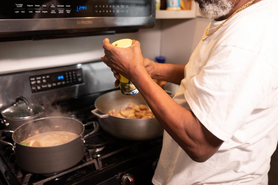 Free Image of Man Cooking Food in Kitchen 