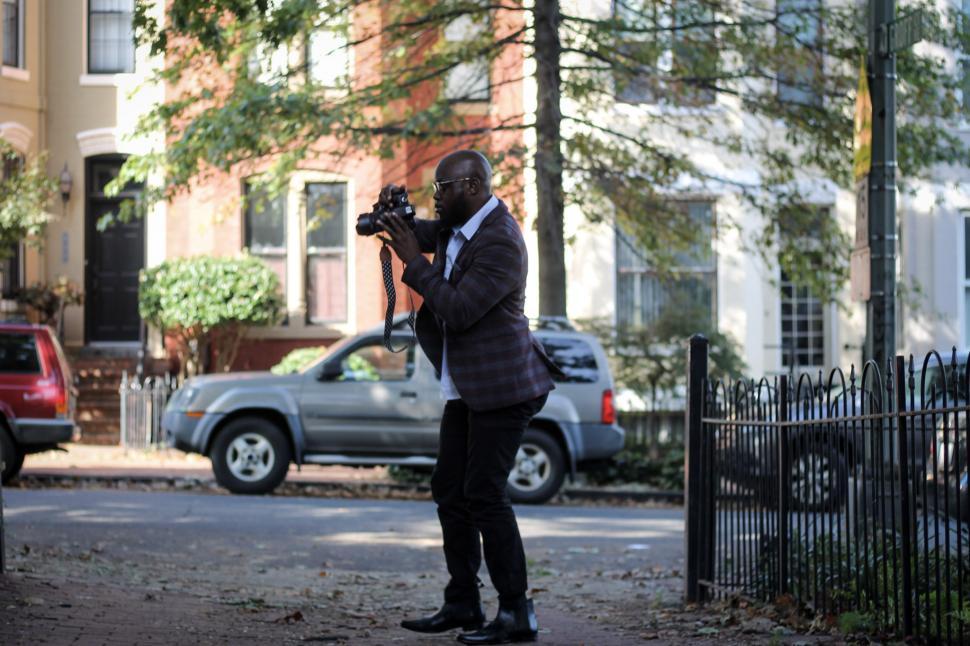 Free Image of Young photographer with professional DSLR camera 
