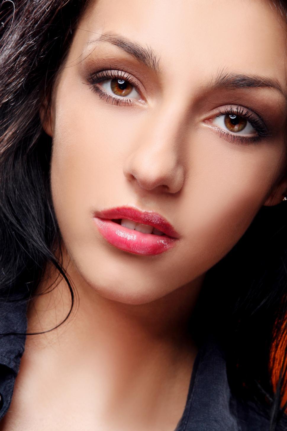 Free Image of young woman, dark hair, looking at camera 