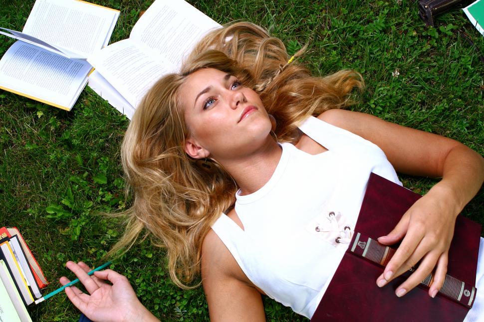 Free Image of young attractive student looking up at the sky 