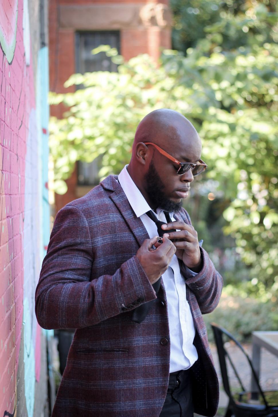 Free Image of Young businessman adjusting his neck tie 