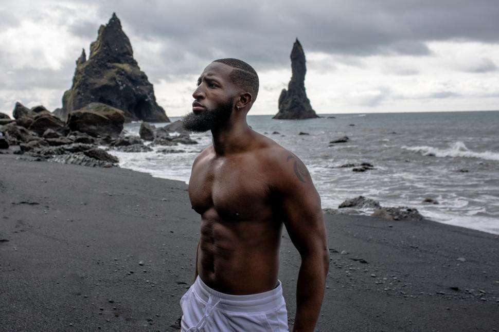Free Image of Young Shirtless Man at Seashore 