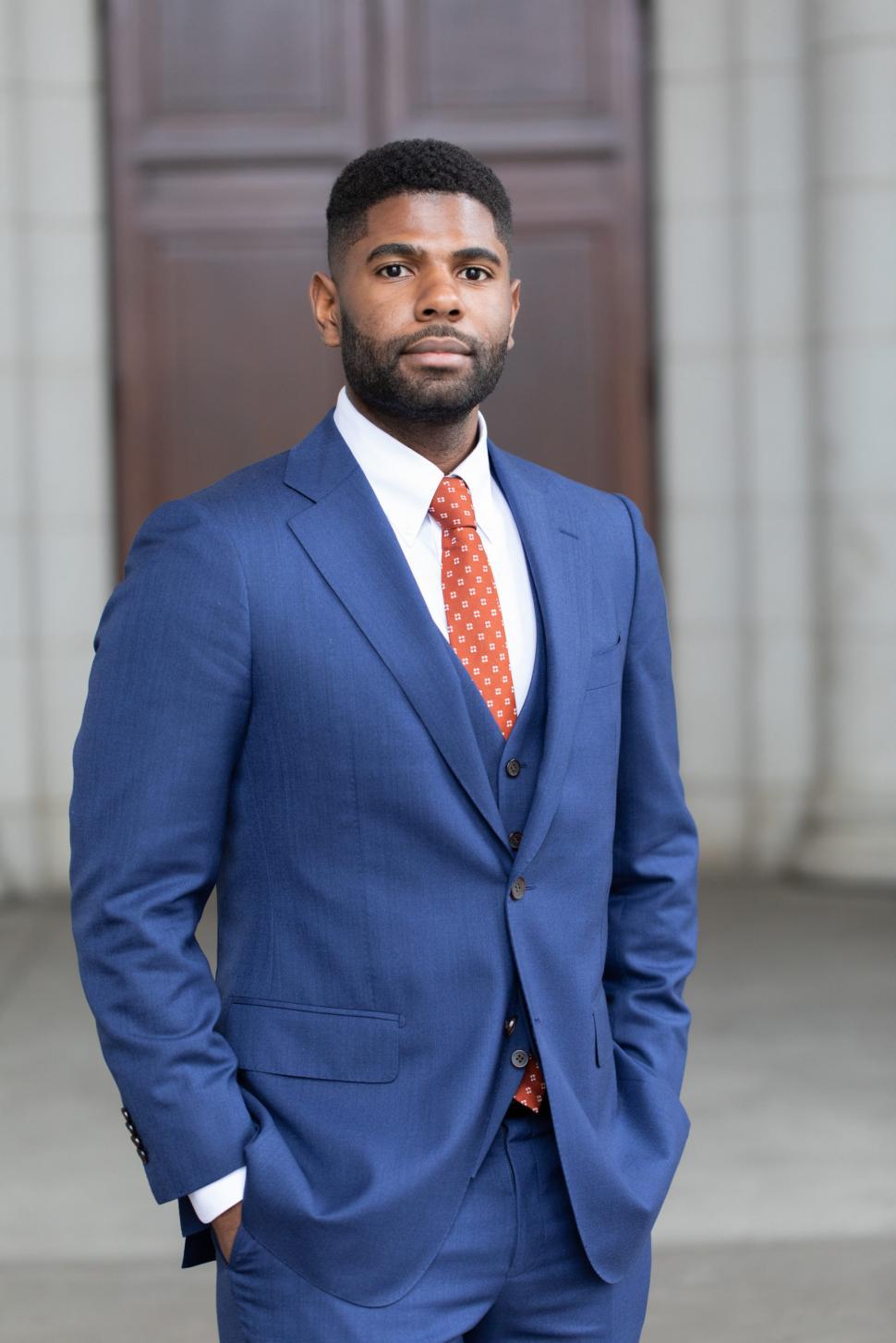 Free Image of Young Businessman in Blue Suit with hands in pocket 