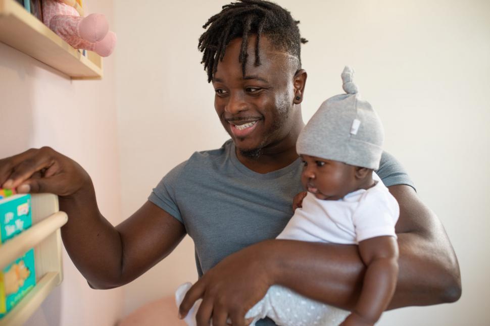 Free Image of Smiling Young Father with Little Baby 