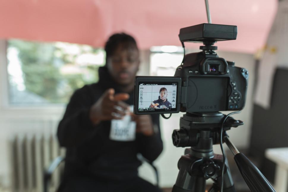 Free Image of Camera on a tripod filming a blogger 