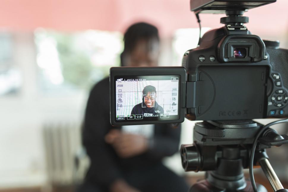 Free Image of Camera on a tripod shooting a blogger 