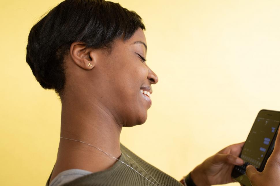 Free Image of Woman Using Mobile Phone in Office 