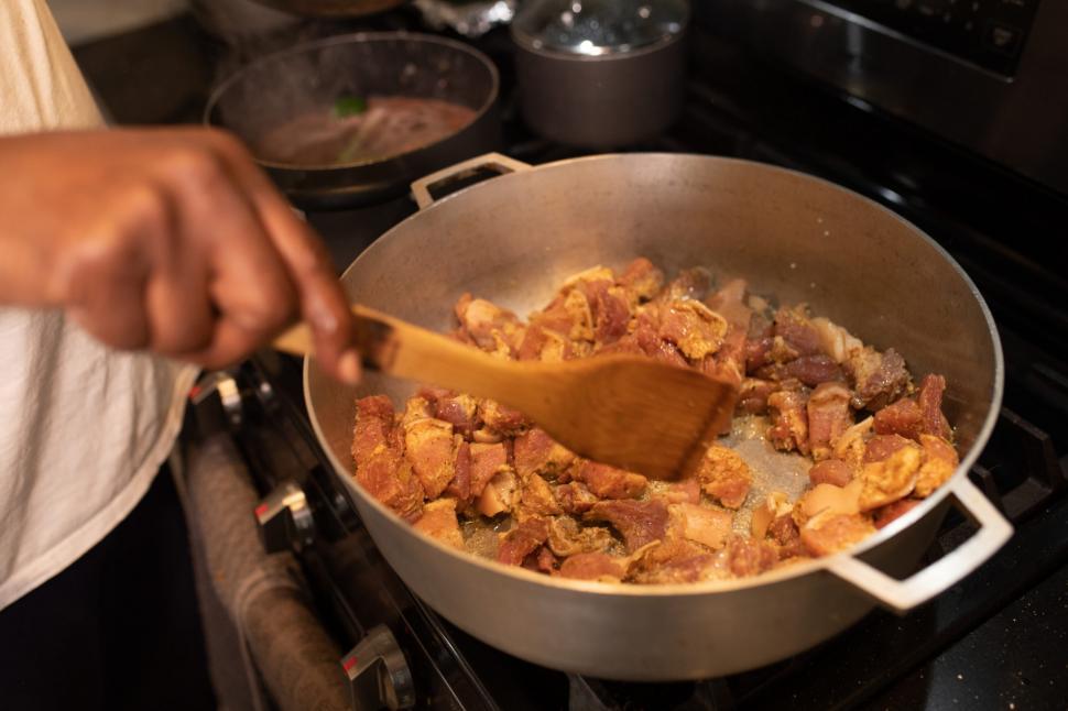 Free Image of Preparing Food on kitchen stove 