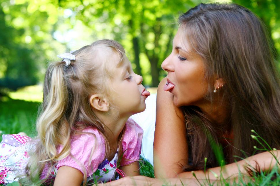 Free Image of sweet girl being silly with mom 