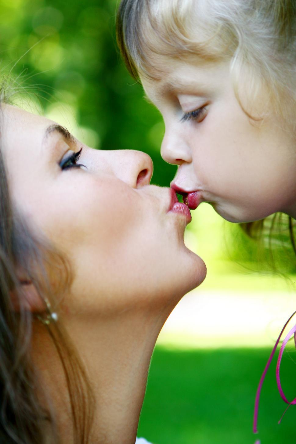 Free Image of mom kissing her child 
