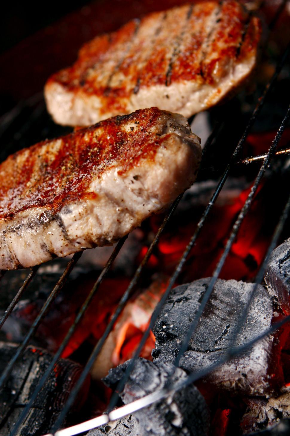 Free Image of a fresh grilled steak over hot coals 