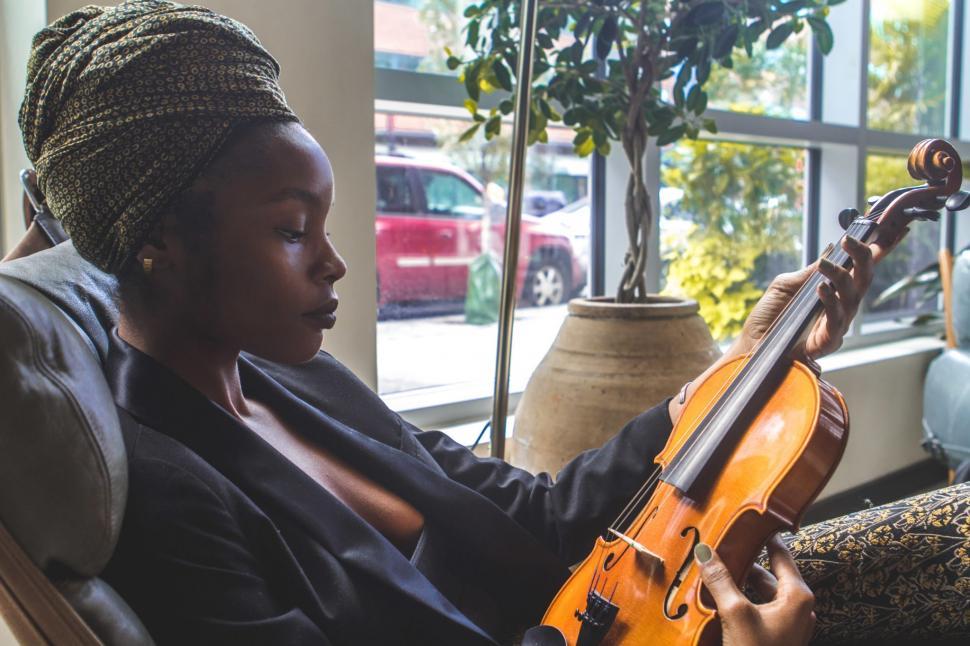 Free Image of Young Business Woman in black blazer with Violin 