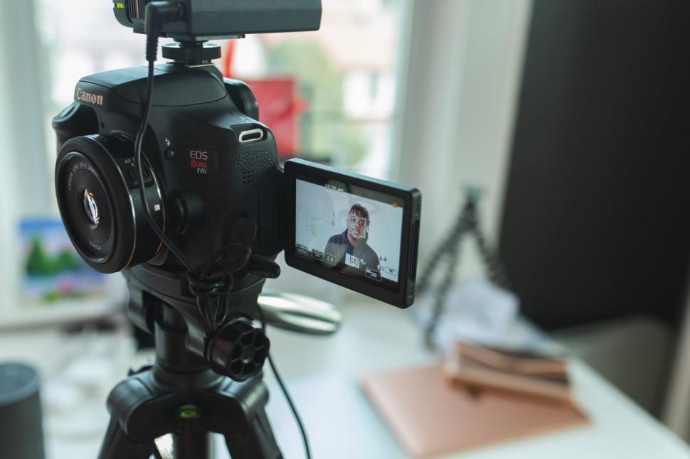 Free Image of Young Man Vlogging With Canon Camera 