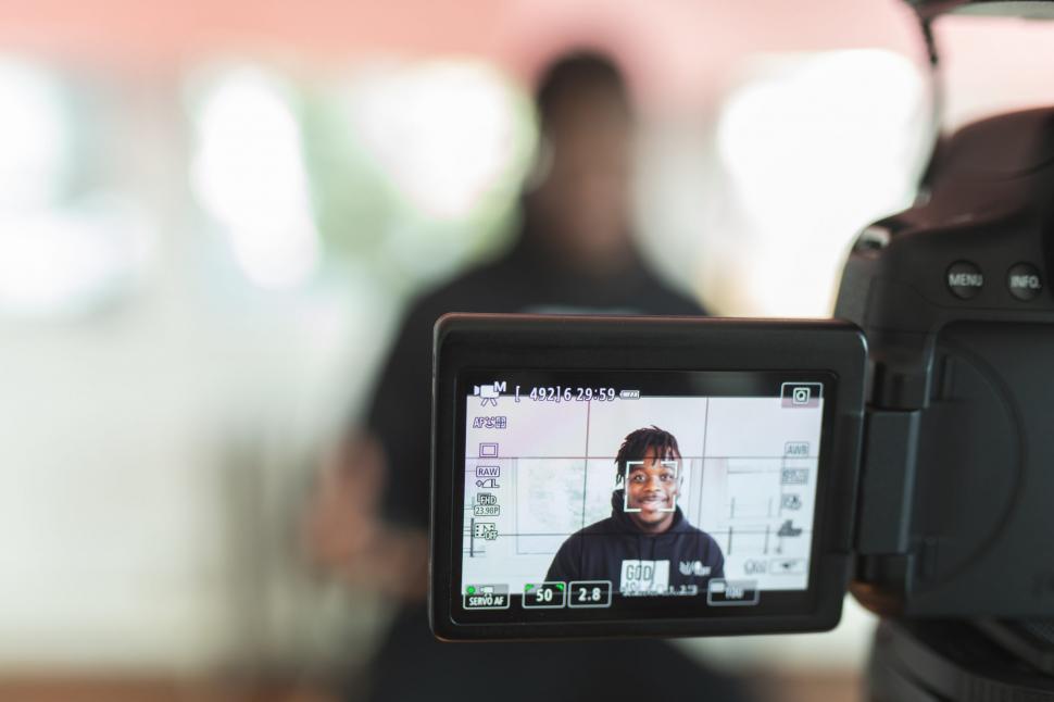 Free Image of Young Man Vlogging With DSLR Camera 
