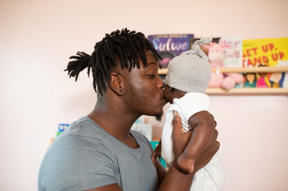Free Image of Young Father With Little Baby at home 
