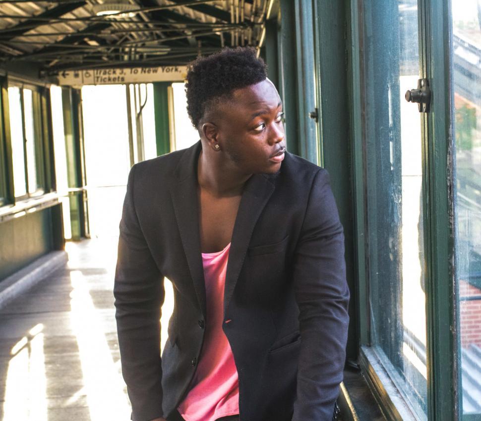 Free Image of Young Man in Black Blazer and Pink T-shirt - looking away 
