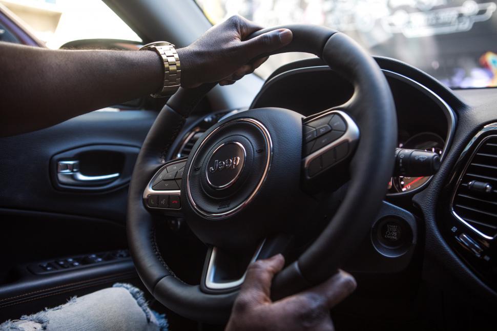 Free Image of Young Man Driving in an SUV - face not seen 