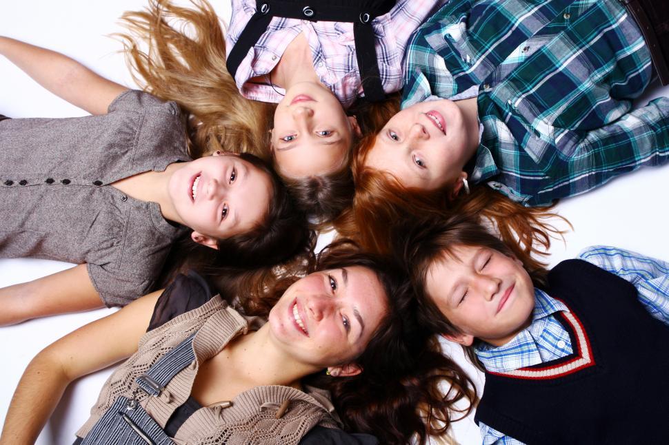 Free Image of Circle of cute and happy kids posing on white background 