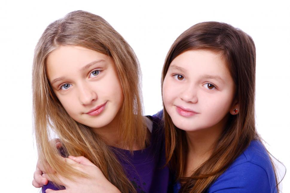 Free Image of Two happy kids posing on white background 