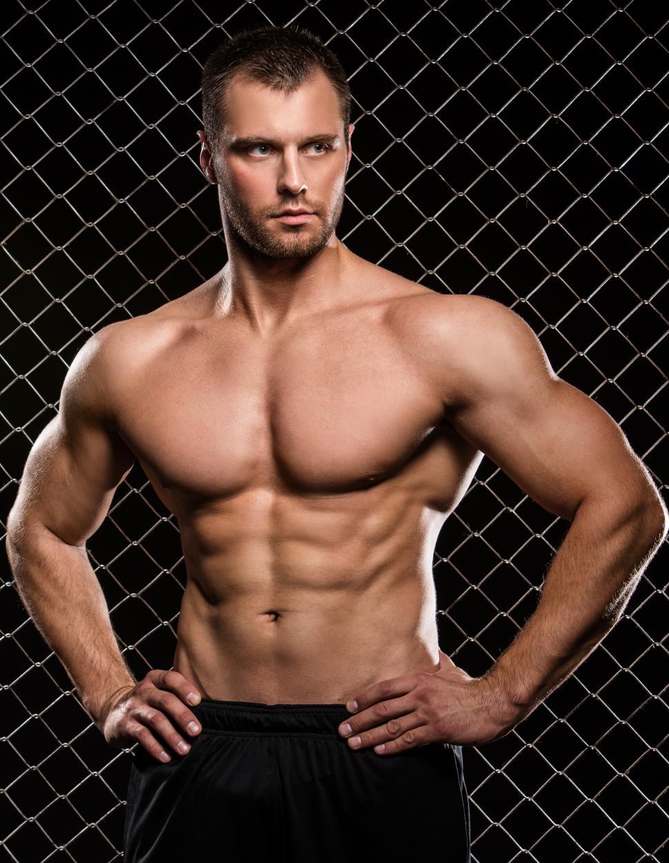Free Image of Shirtless muscular man standing with hands on hips 