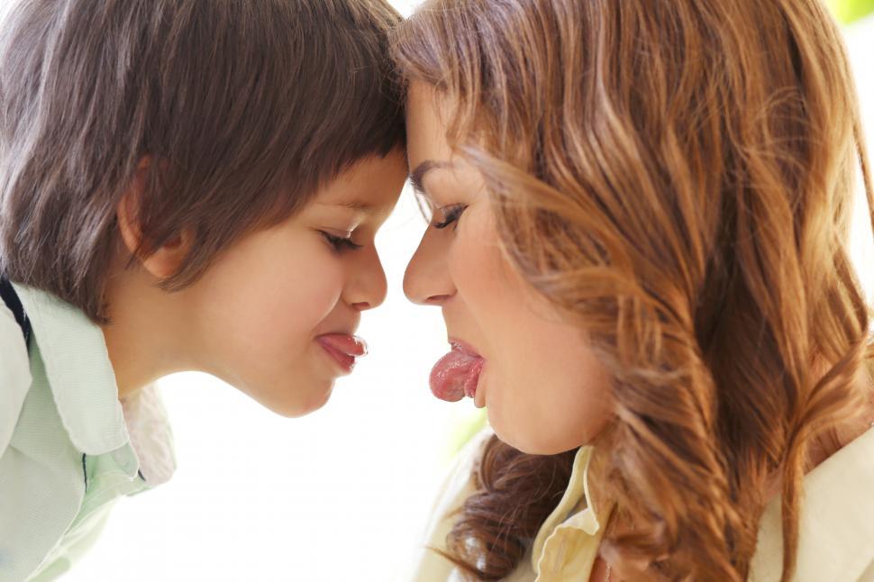 Free Image of Adorable kid and mother, being silly together 