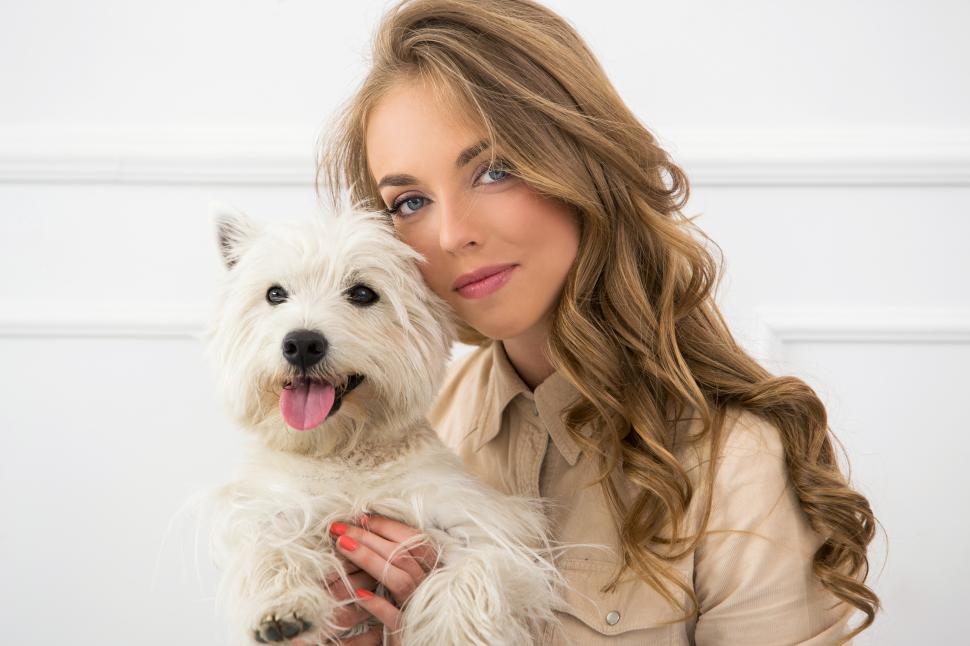 Free Image of Beautiful girl hugging her dog 