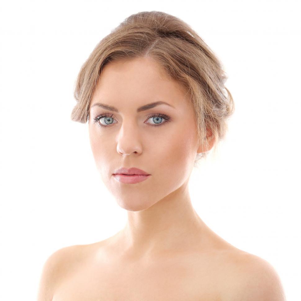 Free Image of Head and shoulders shot of woman with hair up 