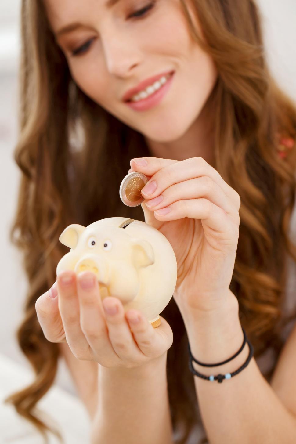 Free Image of Attractive girl with moneybox, piggy bank 